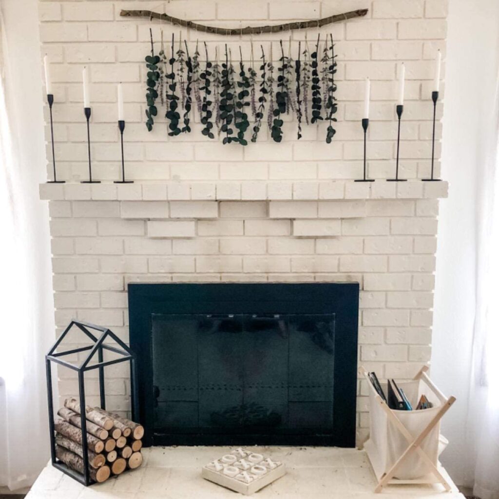 white-fireplace-black-candlestick-holders