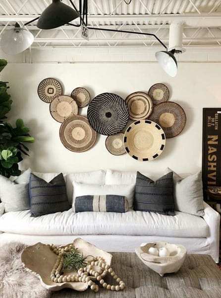 baskets-on-wall-white-couch-black-pillows
