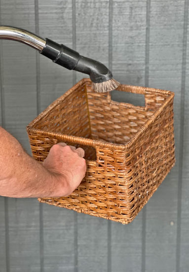 using-a-vacuum-brush-tool-to-clean-wicker-basket
