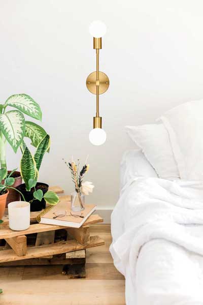 gold-wall-sconce-next-to-bed-cozy-ideas-lighting-up-reading-nook