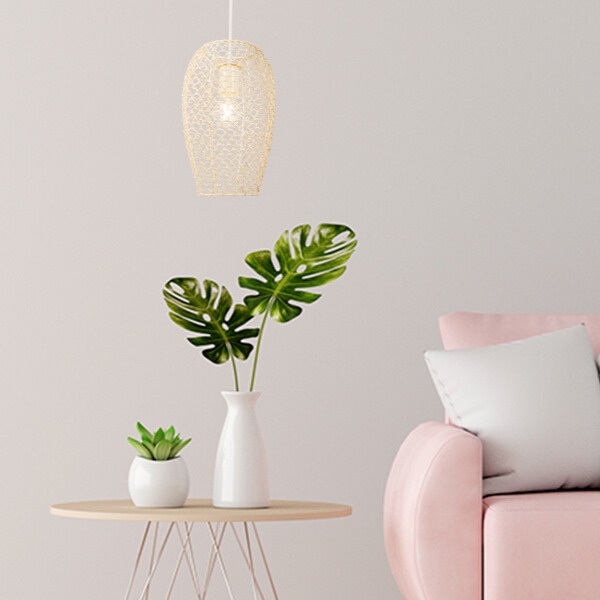 cage-pendant-light-over-side-table-beside-pink-couch
